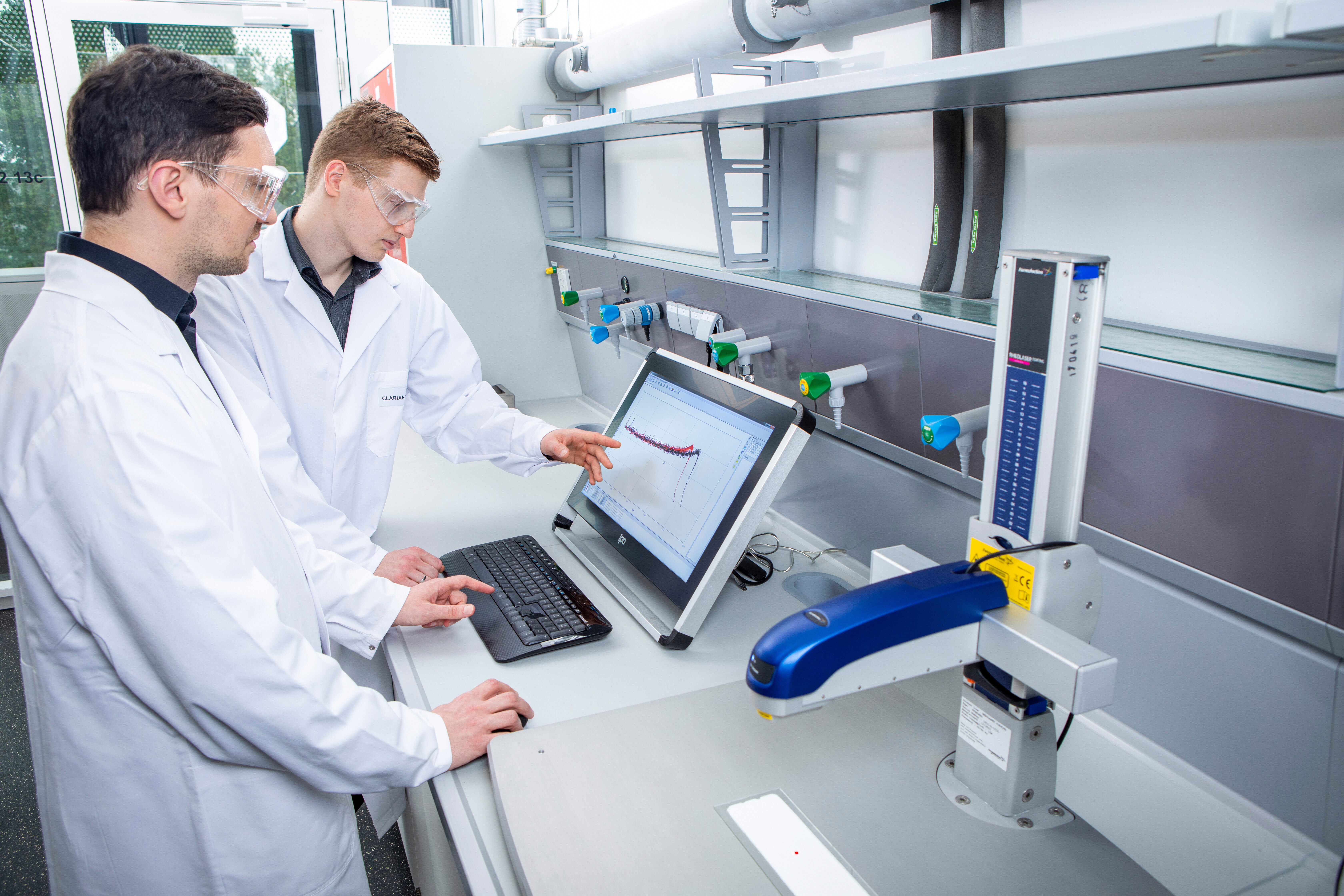 Clariant experts reviewing the results of advanced measurements to assess open time.